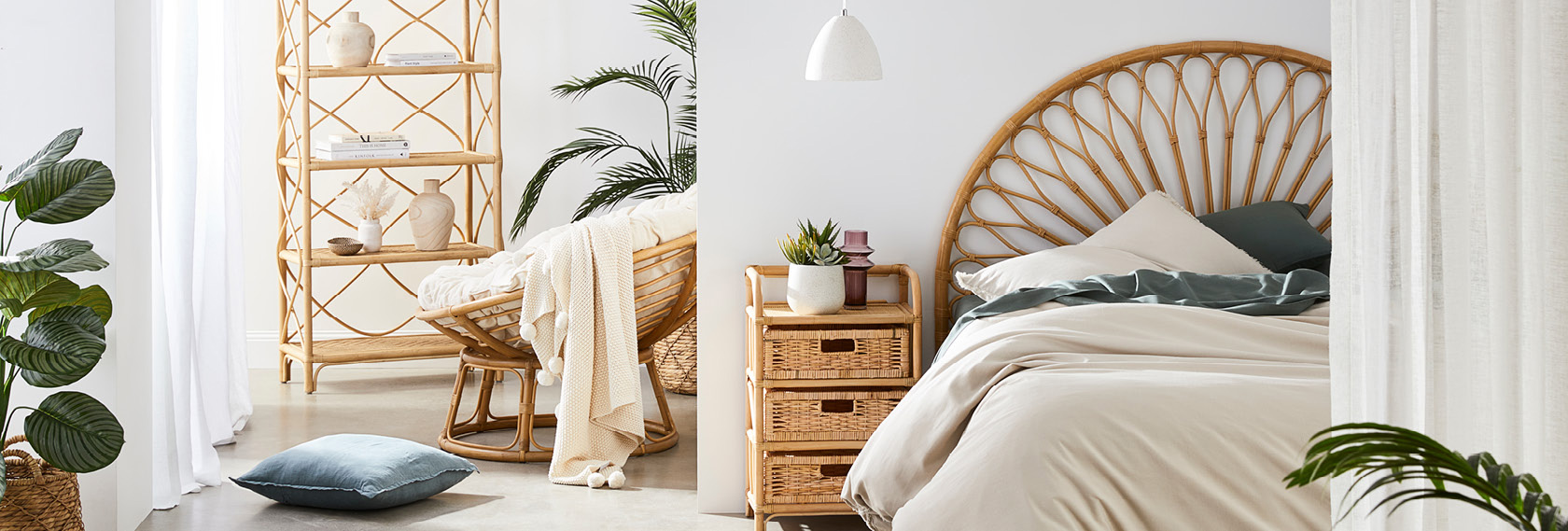 bed on the right with white and moss sheets and pillow case, grey pillow on the floor with a light wooden chair and a beige throw covering the top